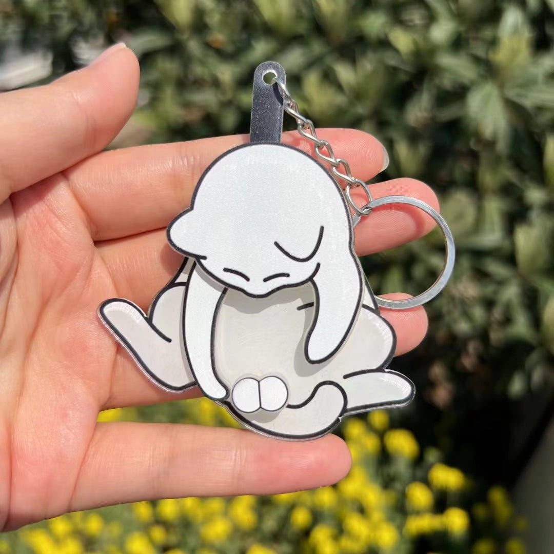 Playing with eggs and kitten keychain